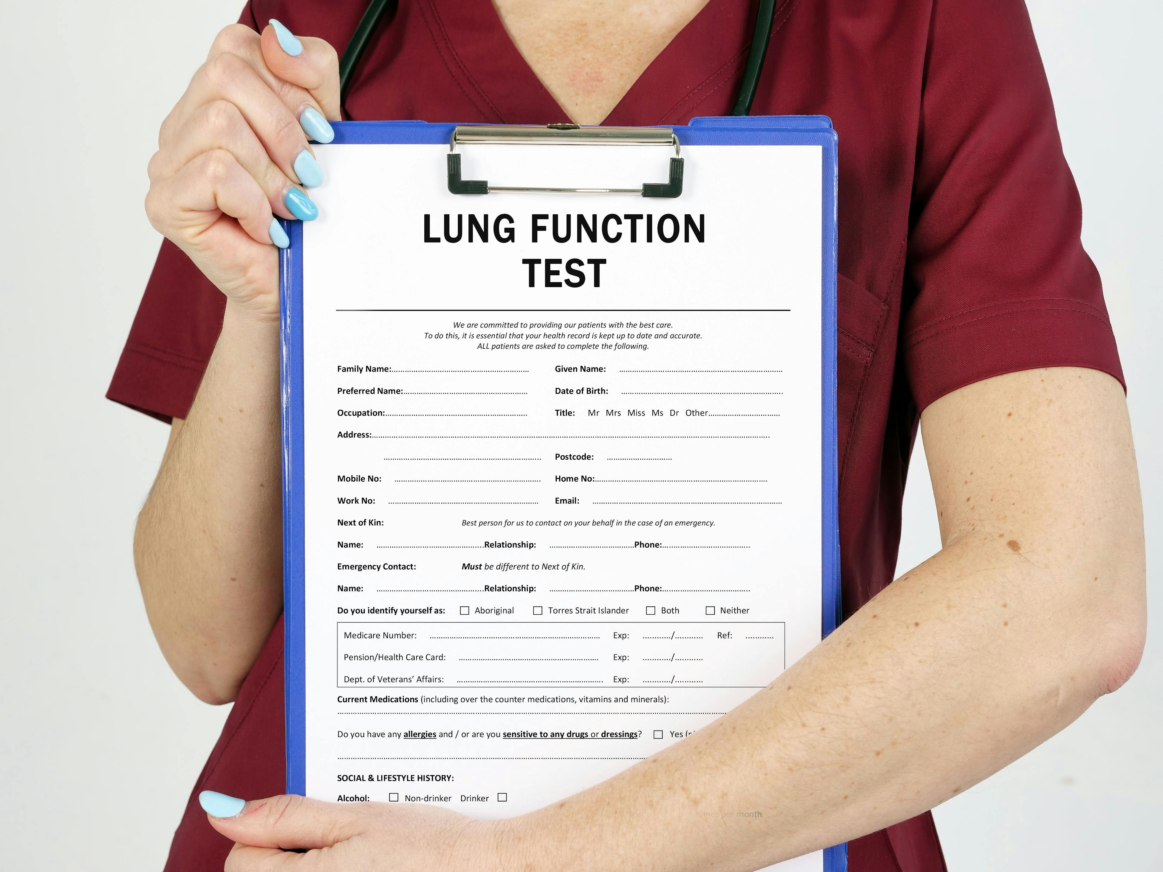 Woman holding a form that ways lung function test | Image credit: ©Yuri Kibalnik