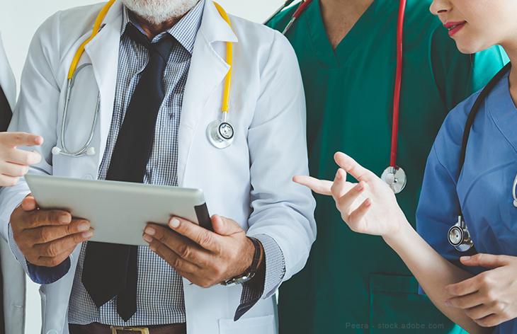 Doctors with tablets