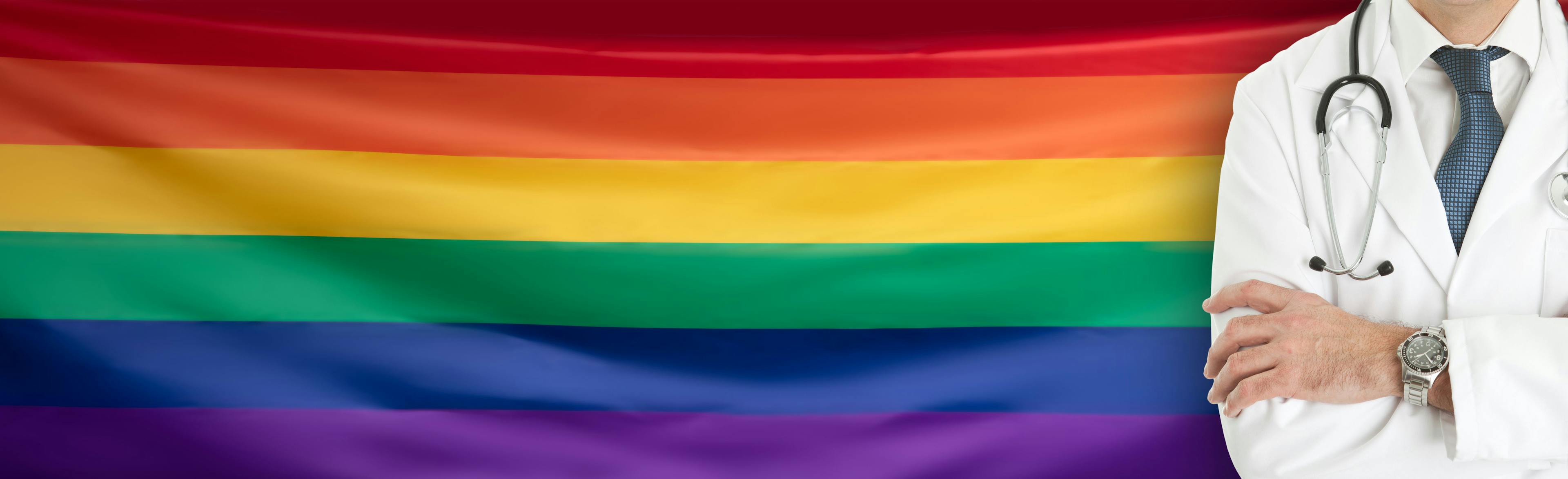 Doctor w LGBTQ rainbow flag | Image credit: © Syda Productions  stock.adobe.com
