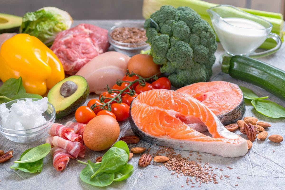 picture of various food items including salmon, egg, avocado, and various vegetables