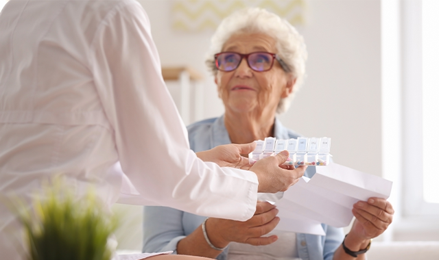 Elderly female patient receiving medication