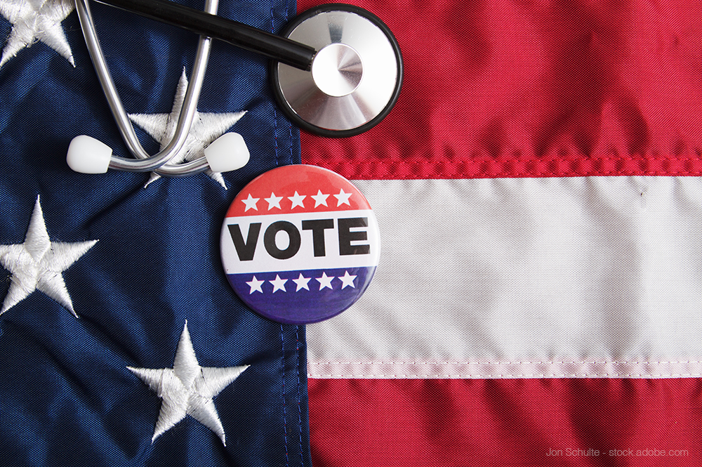Vote button near stethoscope and American flag
