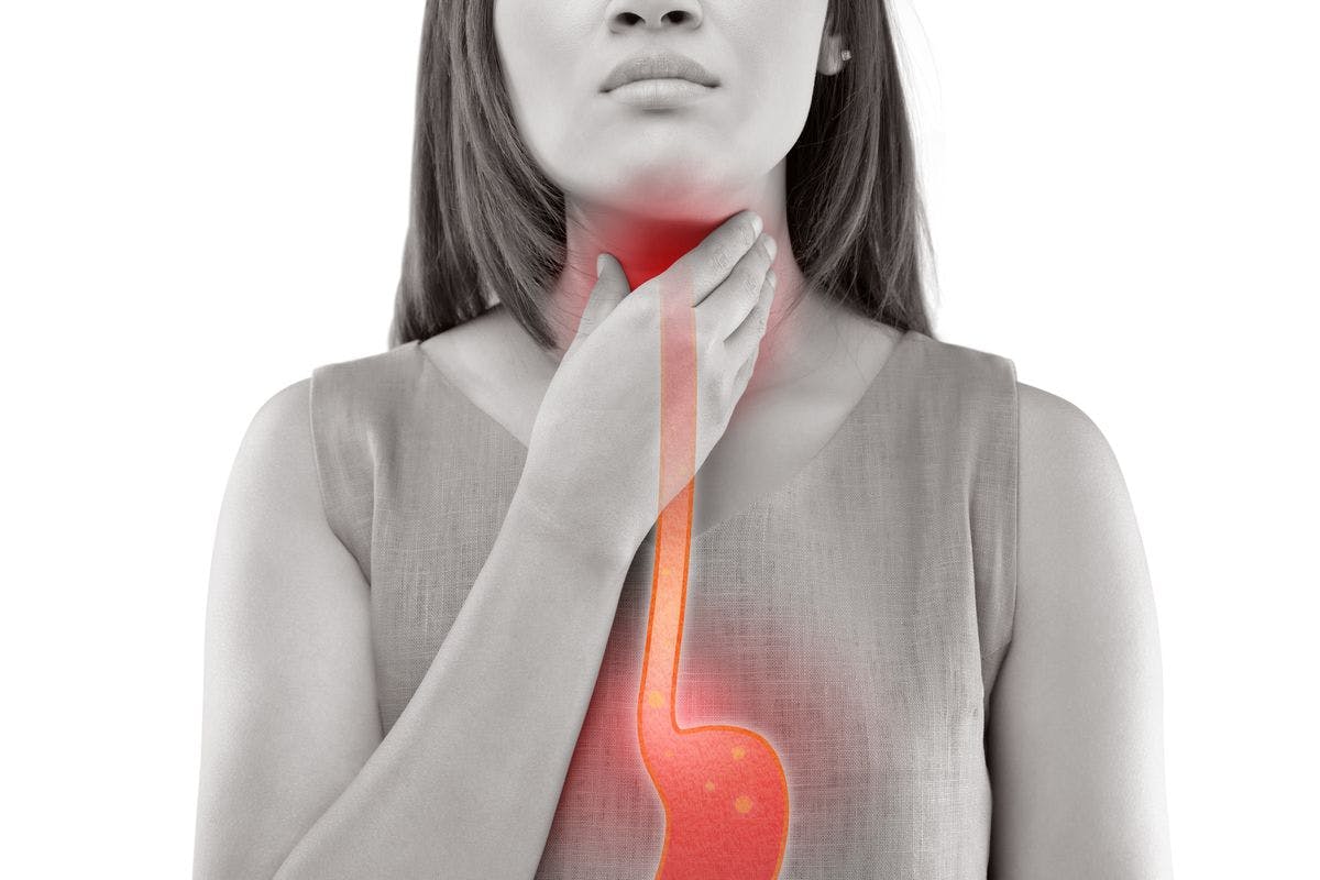woman grabbing throat with esophagus highlighted